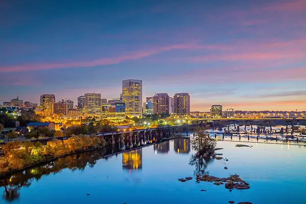 Richmond, Virginia city skyline reflecting on the river at sunset